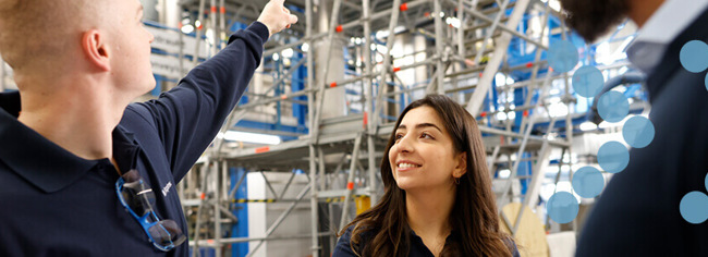Coperion employees standing in test center