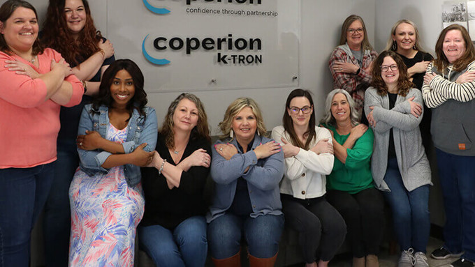 Group of women on International Women's Day at Coperion office Salina